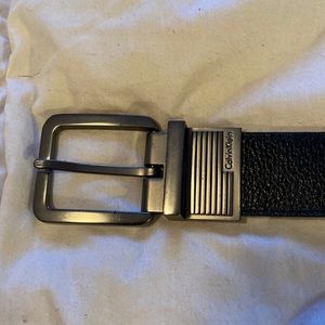 Calvin Klein mens dark brown leather belt. 34”. Gunmetal gray metal buckle.